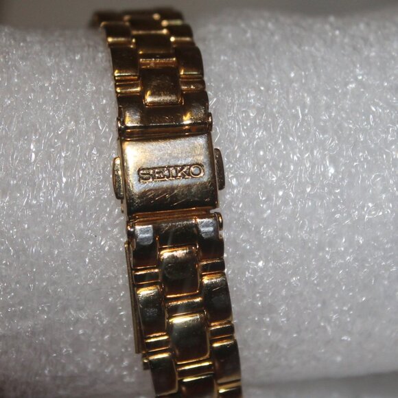 $599 Seiko Solar Mother of Pearl Dial Crystal Bezel Gold Stainless Steel Watch